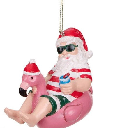 Beach Santa auf Flamingo-Schwimmreifen