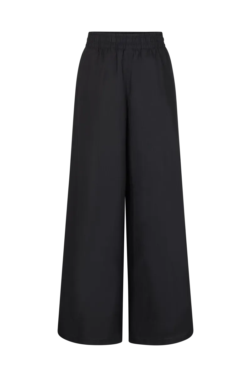 DRYKORN CEILING Leinenhose aus 100 % Leinen mit weitem Bein, elastischem Gummibund, Low-Waist-Passform und entspannter Sommer-Silhouette.