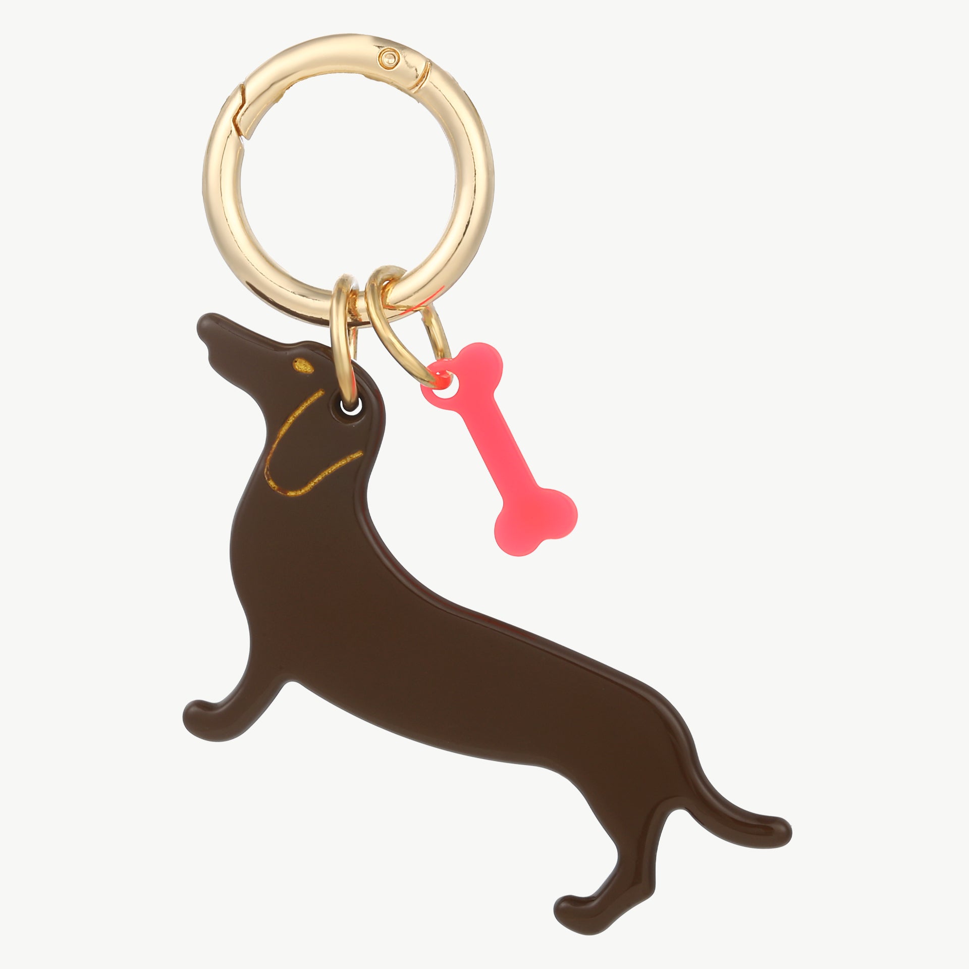 Taschenanhänger mit braunem Dackel, pinkem Knochen und goldfarbenem Befestigungsring
